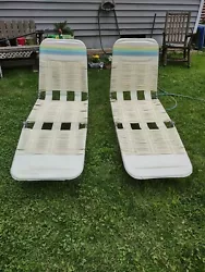 These chairs are folding and adjustable for various reclining positions. There is a small slice in the vinyl of 1 chair...