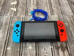 NINTENDO SWITCH HANDHELD - HAC-001. With charger. Switch works great. The rubber has came off the analog sticks on each...