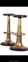 This rare vintage bar stool Set is a must-have for any nautical or Art Deco enthusiast. Crafted with brass and red...