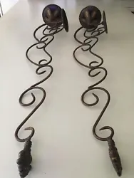Beautiful 32” high candle holders (pair) in a scroll design and an “antique” brown color. Hook to hang. Pictures...