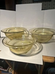 Up for sale is a set of three amber-colored, vintage Federal Glass mixing bowls with a ribbed pattern and rolled edges....