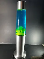 Working Hot Rock Lite F/X Lava Lamp Silver Blue liquid Yellow Lava. Please see pictures for condition. Feel free to ask...