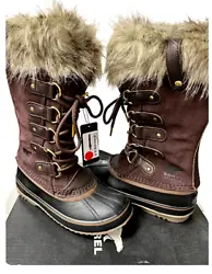 Sorel crafts a waterproof exterior out of suede leather. Faux fur cuff around outside. and adds a faux shearling cuff...