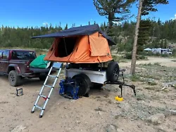 The tent is a nice Tepui Kukenam 3. Everything works on the tent and trailer. The spare tire is included for piece of...
