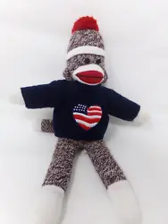 Perfect for 4th of July. He has the traditional brown and white sock body with embroidered features on his face....