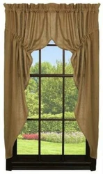 This is a new set of lined prairie swags that are made of cotton burlap fabric.