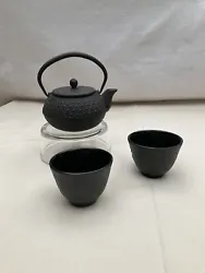 Cast Iron Japanese Tea Kettle With 2 Cups. No base stand for pot.Nice small set.Matte black.Stamped by maker. I can’t...