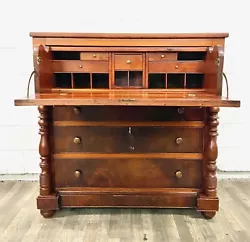 This is an absolutely stunning antique 19th century American Empire flame mahogany drop front butler desk or secretary...