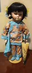 1991 Brinns Collectible Rare Oriental Doll with umbrella. Approximately 16
