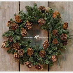 Features green and brown pine wired branches with an abundance of pinecones. Pine Wreath with Cones / Candle Ring. Also...