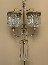 Approximately 65” high 17” wide 2 lights. Exquisite crystal floor lamp candelabra. All prisms accounted for. Wear...