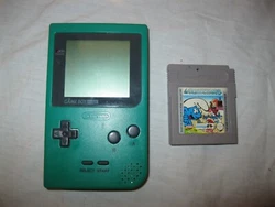 LES SCHTROUMPFS. Ancienne CONSOLE DE JEU. + 1 JEU SANS BOÎTE SANS NOTICE.