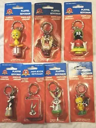Looney tunes play for keychains lot of 7 include tweedy bird Sylvester ,Marvin the Martian, bugs bunny Tasmanian devil....