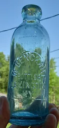 Aqua or blue-green hutchinson soda bottle embossed: 