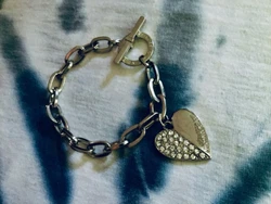 This bracelet is used and is about 8” long. Condition is excellent. There is light reflection in the photos.