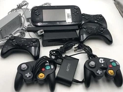 Item: A Nintendo Wii U with related accessories. Sensor Bar.