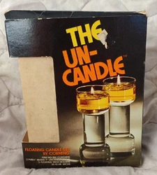 This is a throwback to the 1970s. Floating candle set made by Corning. Never used. Everything is included.