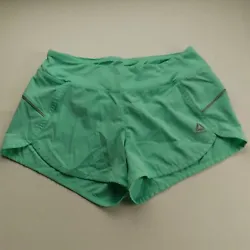 Reebok lined athletic shorts in aqua/teal with silver trim - has waistband pocket in back. Length 10