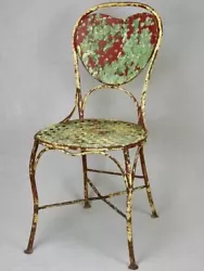 An unusual heart back garden chair from the early twentieth century. The heart shape is particularly pronounced from...