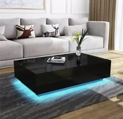 The led center table for living room with 4 storage drawers, large Desk top and open shelf. This modern black coffee...