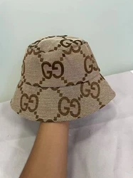 Gucci Brown UV-protected breathable Fishermans hat with GG logo print.