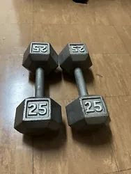 Enhance your workout routine with this pair of 25 lb. cast iron dumbbells. Designed for strength training and...