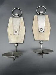 Enhance the ambiance of your living space with this charming set of rustic pulley candle sconce holders.