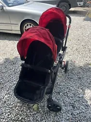 Introducing the Contours Options Elite Tandem Stroller in a vibrant shade of Red. This stroller offers seating capacity...