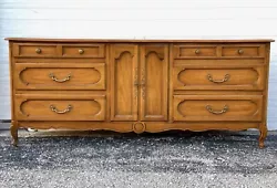 This is an absolutely stunning vintage French Provincial style triple dresser by Century. This beautiful piece features...