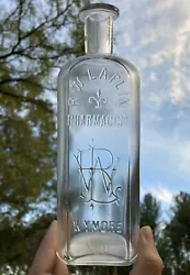 Antique R.W. LAFLIN - PHARMACIST - WYMORE, NEBRASKA drugstore bottle. Blown bottle circa 1890-1910.Scarce large 8