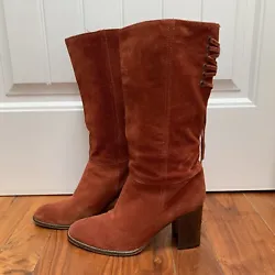 Beautiful rust suede boots - perfect for fall!Almond toeLace up back detailPull on styleSome scuffs and marks, but good...