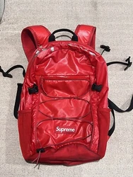 Supreme FW17 Backpack Red. Preowned - outside is in excellent condition. There are some dark spots on the bottom. The...