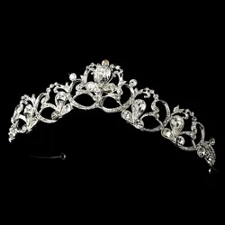 A silver ribbon detail weaves through stunning rhinestones in this beautiful tiara.