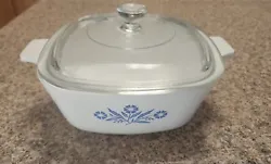 This vintage CorningWare casserole pan is a must-have for any collector or home cook. The blue floral pattern on a...