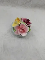 Flowers made of Fine Bone China. Flowers in good condition flea bite on a pedal. pink, yellow, purple flowers.
