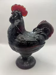 This vintage candy dish is a beautiful addition to any collection. The deep red color and intricate rooster design make...