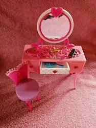 2012 Barbie Glam Vanity with mirror and accessories. Condition/Flaws:All pieces are gently used. Middle drawer opens.