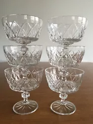 For sale are 6 pre-owned glass dessert glasses with a pressed cross-cut diamond pattern. One glass has very small,...