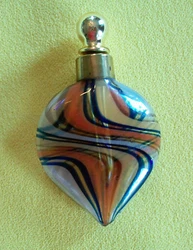 Clear with swirls of blue, orange, yellow & white.