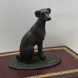 Sculpture Statue Dog Terrier Sitting On Red Book.