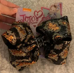 This JoJo Siwa bow is brand new still attached to the original packaging. From a smoke-free, pet-free home.