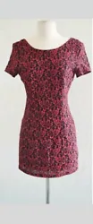 Red and black floral short sleeve dress with black lining underneath. It does have a zipper in the back.