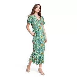 •Midi dress with large zinnia floral print •Lightweight, breathable fabric •Short bell sleeves •V-neckline...