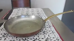 A copper bottom with a brass handle frying pan 10