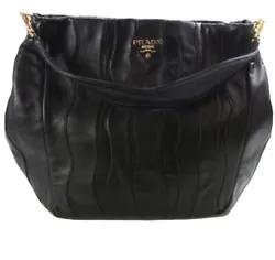 Authentic, pre-loved, and wonderfully cared for, this sophisticated Prada shoulder bag is finely crafted of black Nappa...