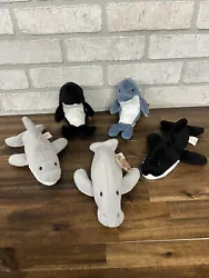 This lot of 5 TY Beanie Babies includes Manny Manatee, Splash the Whale, Waves the Whale, Flash the Dolphin, and Echo...