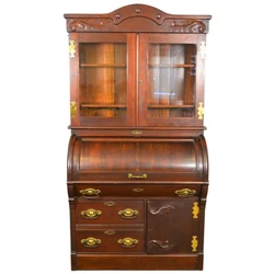 We are pleased to be offering today this most unusual cylinder secretary desk constructed of black walnut and mahogany....