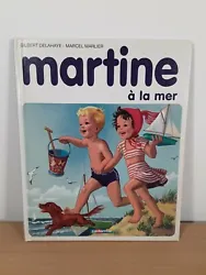 Livre Martine a La Mer Edition Casterman. 1983 Plutot en tres bon etat Une tres legere dechirure sur le haut dune page...