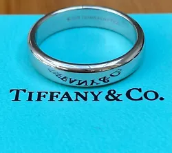 The ring is hallmarked 1999 Tiffany & Co. The ring is a size 8.5 and is resizable. Stunning Tiffany & Co. 4mm Platinum...