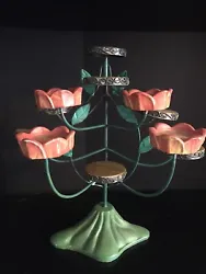 This beautifully unique candleholder is made from metal and hand painted. Standing at 10.5 inches tall with a 6 inch...